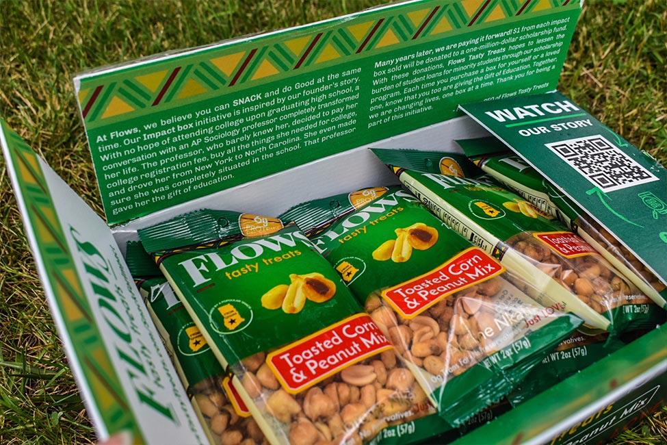 Box of Flows Tasty Treats snack packs prepared for community distribution